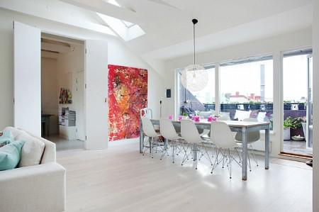 ventanas en el techo tejado decoración sofas blancos sillas eames mesas de metal estilo sueco decoración estilo nórdico estilo escandinavo decoración espacio diáfano decoración diseño de interiores nórdico decoración escandinava decoración diáfana decoracion de lofts decoración de interiores en blanco Decoración de estilo nórdico en un ático loft decoración de áticos 