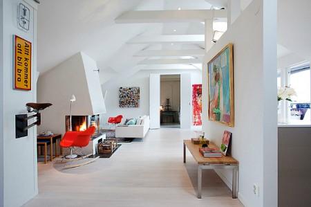 ventanas en el techo tejado decoración sofas blancos sillas eames mesas de metal estilo sueco decoración estilo nórdico estilo escandinavo decoración espacio diáfano decoración diseño de interiores nórdico decoración escandinava decoración diáfana decoracion de lofts decoración de interiores en blanco Decoración de estilo nórdico en un ático loft decoración de áticos 