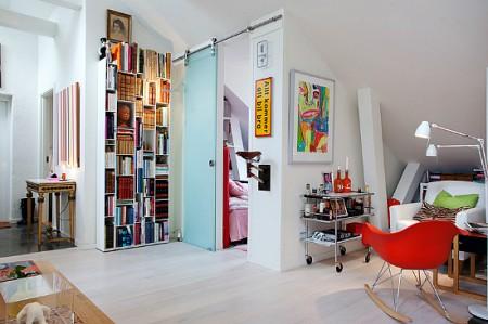 ventanas en el techo tejado decoración sofas blancos sillas eames mesas de metal estilo sueco decoración estilo nórdico estilo escandinavo decoración espacio diáfano decoración diseño de interiores nórdico decoración escandinava decoración diáfana decoracion de lofts decoración de interiores en blanco Decoración de estilo nórdico en un ático loft decoración de áticos 