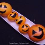 Naranjas, mandarinas y pomelos disfrazados de Calabazas de Halloween