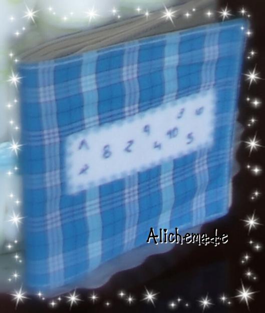 Portada del libro de tela con números y animalitos para niños.