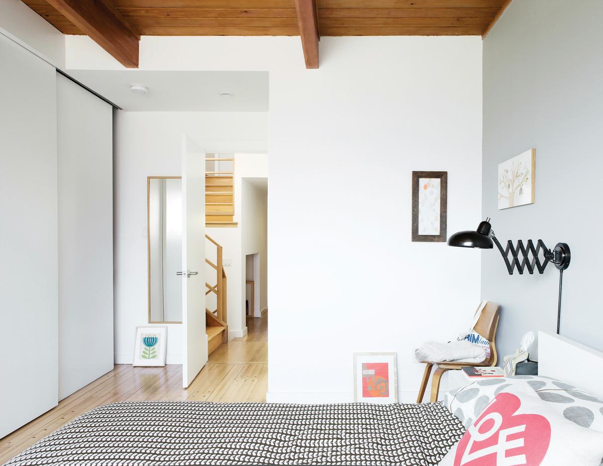 level-headed-rolling-wooden-doors-closet-shelving-bedroom
