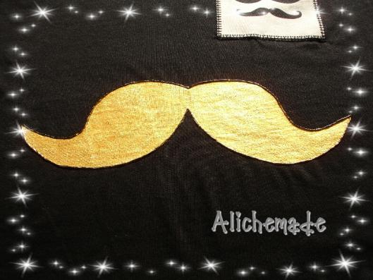 Detalle del bigote pintado a mano de la camiseta para chico.