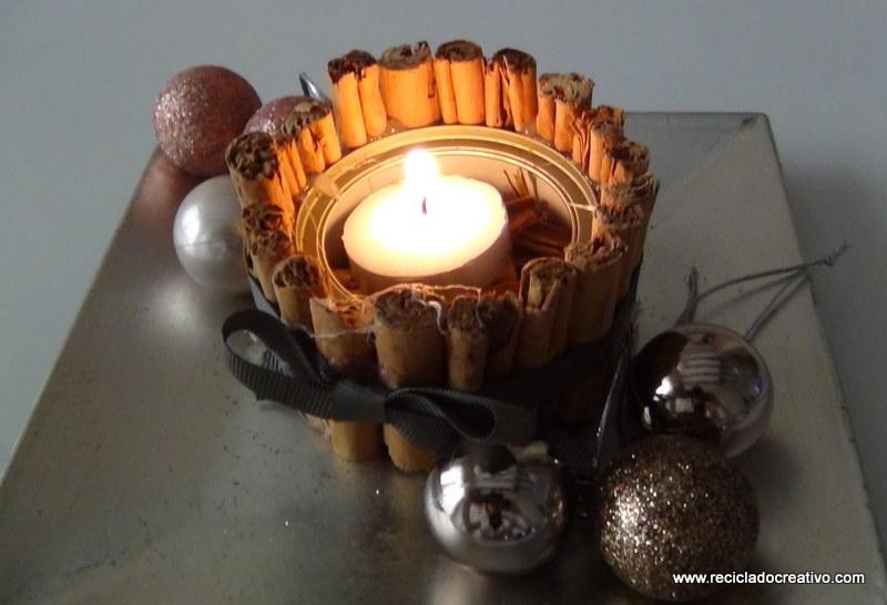 Portavelas con ramitas de canela, reciclando latas de atún