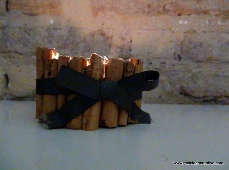 Portavelas con ramitas de canela, reciclando latas de atún