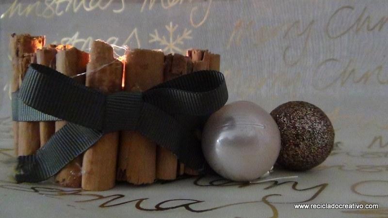 Portavelas con ramitas de canela, reciclando latas de atún