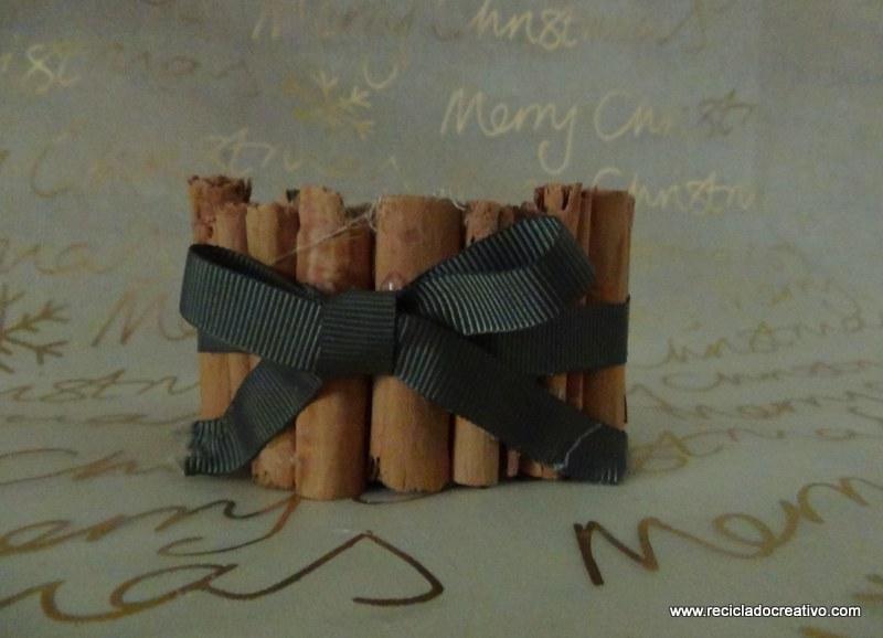 Portavelas con ramitas de canela, reciclando latas de atún