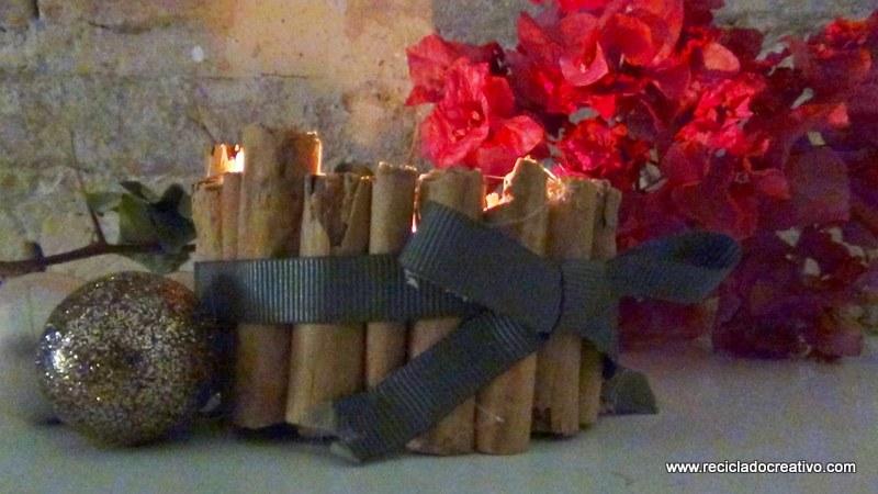 Portavelas con ramitas de canela, reciclando latas de atún