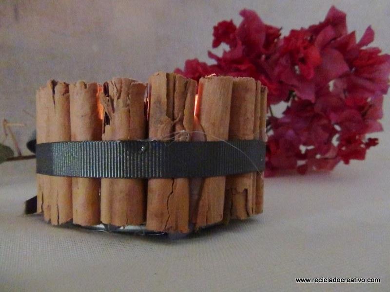 Portavelas con ramitas de canela, reciclando latas de atún