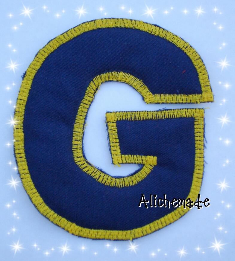 Letra de tela reversible, G.