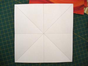 instrucción 1 para hacer una corona navideña de origami