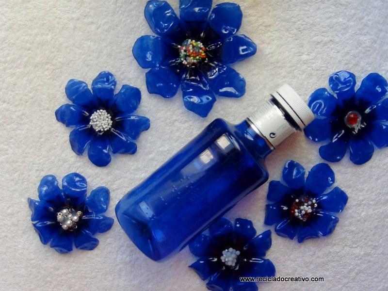 cómo hacer una flor con una botella de plástico verde y una plancha de ropa
